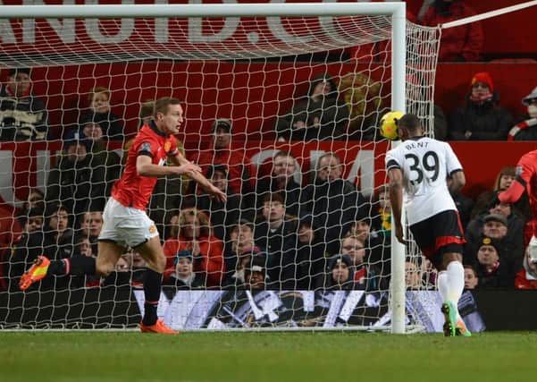 Nemanja Vidic looks on in horror as Darren Bent nods home at the death. Picture: Getty