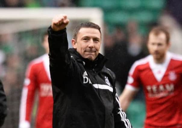 Aberdeen boss Derek McInnes celebrates his side's win over Celtic. Picture: SNS