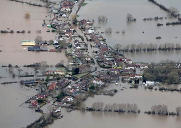 Flooded propeties are seen as water surrounds the village of Moorland on the Somerset Levels near Bridgwater. Picture: Getty