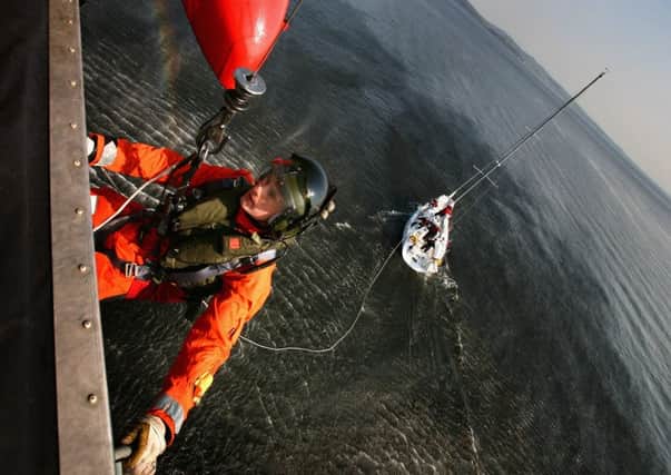 A crew member is winched from a Sea King helicopter from HMS Gannet during a training exercise. Picture: Getty