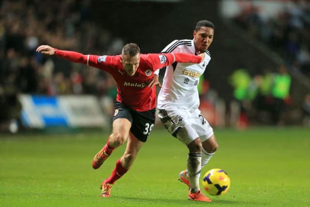 Craig Bellamy, left, clashed with Swanseas Jonathan de Guzman. Picture: PA