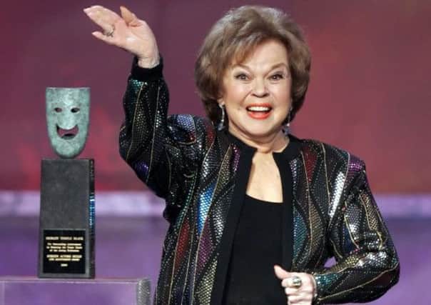 Shirley Temple accepts the Screen Actors Guild life achievement award in 2006. Picture: AP