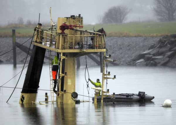 Salvage crew from lifting barge GPS Atlas work on the super-structure of The Flying Phantom. Picture: Donald MacLeod