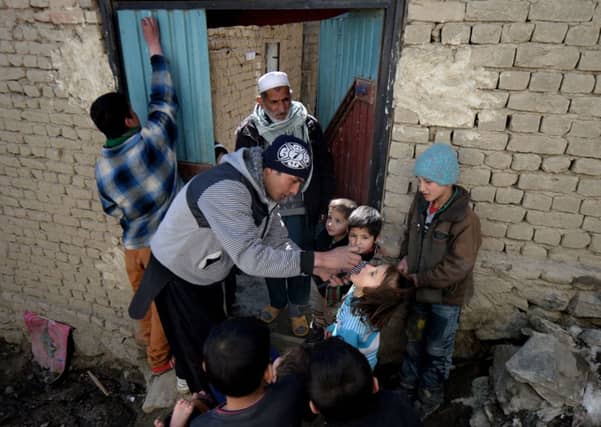 An Afghan youngster is given an oral dose of polio vaccine. Picture: Getty