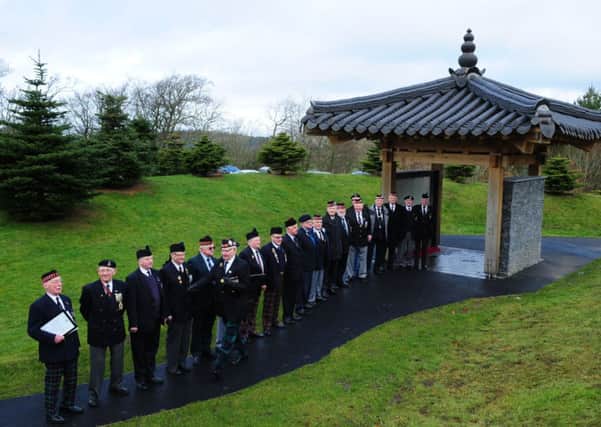 David Mundell MP presents a letter from David Cameron to Korean War veterans in Torphicen, West Lothian. Picture: Ian Rutherford