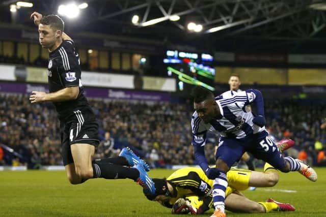 Chelseas Gary Cahill, left, and goalkeeper Petr Cech challenge Thievy Bifouma. Picture: Reuters