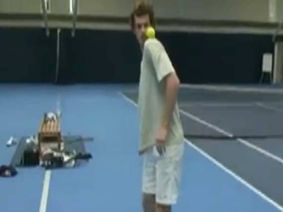 Andy Murray plays keepy-up with a tennis ball