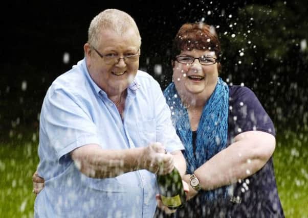 Colin and Chris Weir celebrate their Euromillions win in 2011. Picture: Phil Wilkinson