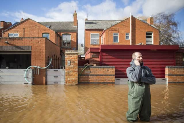 A resident stands in floodwater in Worcester. Picture: Getty