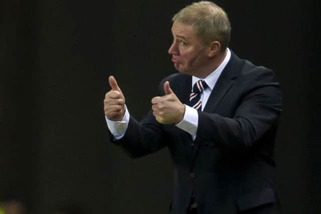 Ally McCoist believes Rangers fans should be happy despite the club's struggle to restore the good times. Picture: SNS