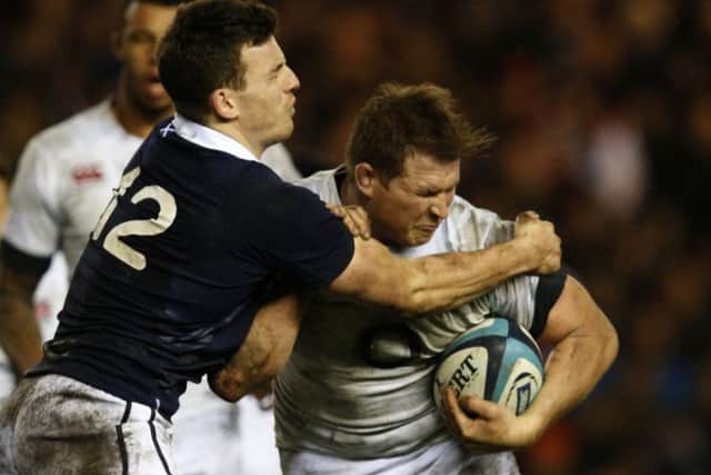 Scotland centre Matt Scott, left, tackles Englands Dylan Hartley. Picture: Reuters