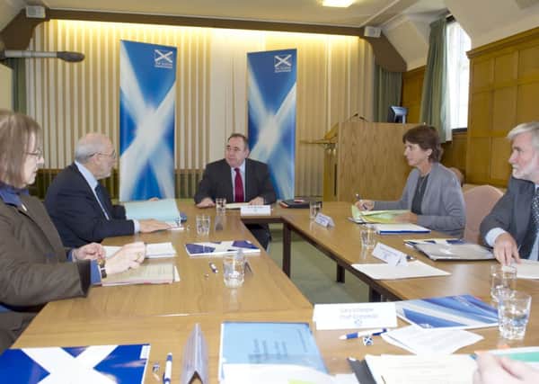 Professor Joseph Stiglitz sits to First Minister Alex Salmonds left; Professors Louise Richardson and Andrew Hughes Hallett are to his right. Picture: Kenny Smith