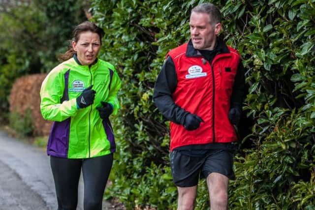 Chris Moyles joins Davina McCall as she runs through Staines on the final leg of her Sport Relief Challenge. Picture: PA