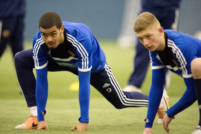 Hearts new loan signing from West Ham, Paul McCallum, left, limbers up during training at Riccarton. Picture: SNS