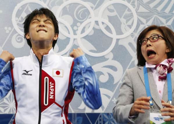 Yuzuru Hanyu and Japan figure skating coach Yoshiko Kobayashi show their emotions after learning of his gold medal success      Picture: Reuters