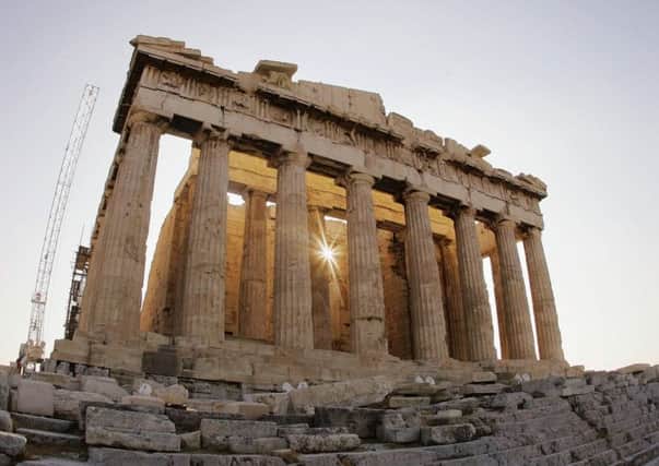 The sun rises through the Parthenon in Athens, Greece. Picture: Getty