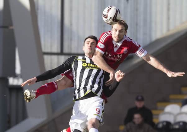 Steven Thompson battles with Aberdeen's Russell Anderson. Picture: PA