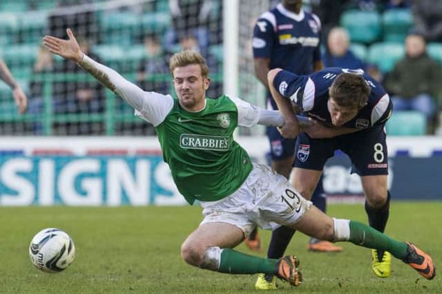 Richard Brittain brings Danny Handling's run to an abrupt halt. Picture: SNS