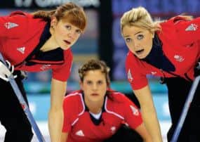 Great Britains Claire Hamilton, left, and Anna Sloan, right, sweep Vicki Adams delivery. Picture: Getty