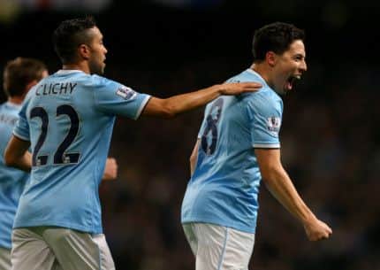 Citys Gael Clichy congratulates Samir Nasri after he scored the second goal against Chelsea in the FA Cup. Photograph: Dave Thompson/PA