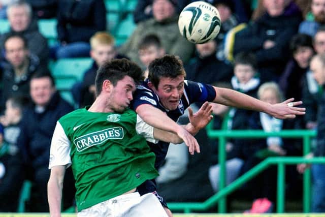 Sam Stanton battles it out with Ross Countys Richard Brittain during Saturdays encounter at Easter Road Picture:SNS