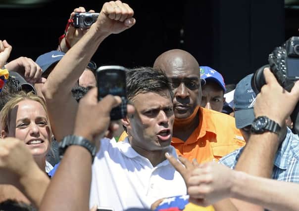 Opposition leader Leopoldo López greets supporters during an anti-government demonstration in Caracas           Picture: AFP/Getty Images