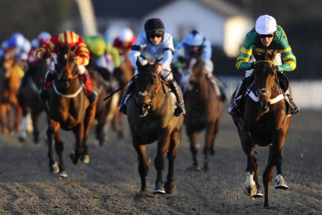 Tony McCoy riding My Tent Or Yours (R) win at Kempton Park. Picture: Getty