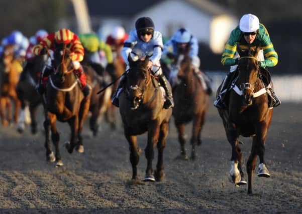 Tony McCoy riding My Tent Or Yours (R) win at Kempton Park. Picture: Getty