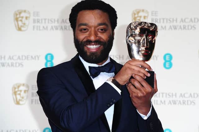 Chiwetel Ejiofor with the Best Actor award for '12 Years A Slave'. Picture: PA