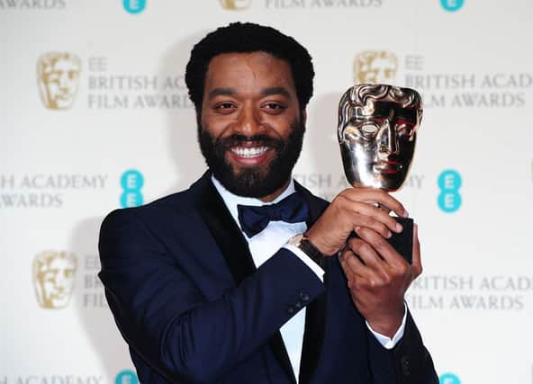 Chiwetel Ejiofor with the Best Actor award for '12 Years A Slave'. Picture: PA