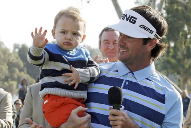Bubba Watson with son Caleb after the Northern Trust Open. Picture: AP
