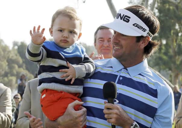 Bubba Watson with son Caleb after the Northern Trust Open. Picture: AP