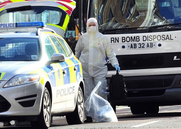 A bomb disposal team works at the scene of one of the package deliveries. Picture: AFP