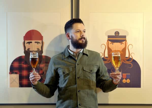 Artist Andrew Park sampling a couple of glasses of the new Drygate beer. Picture: Donald Macleod
