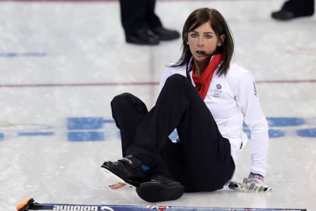 British skip Eve Muirhead slips on the ice after delivering the rock against Russia. Picture: AP