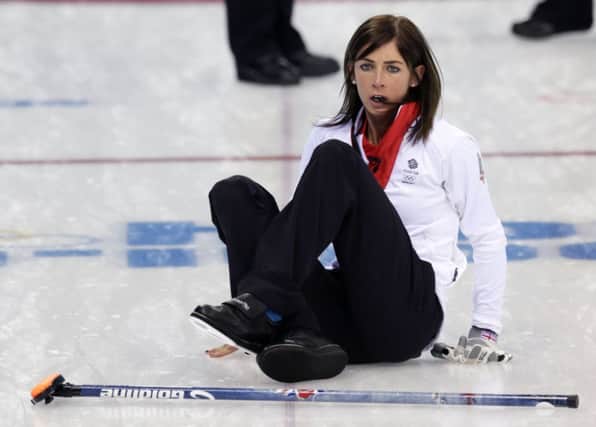 British skip Eve Muirhead slips on the ice after delivering the rock against Russia. Picture: AP