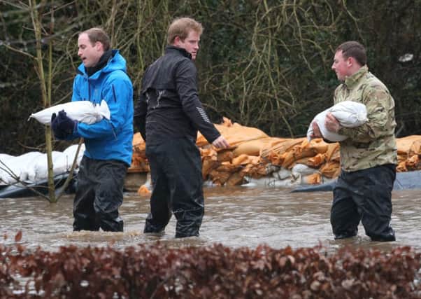 Royal act: even princes William and Harry have helped with the flood efforts. Picture: Getty