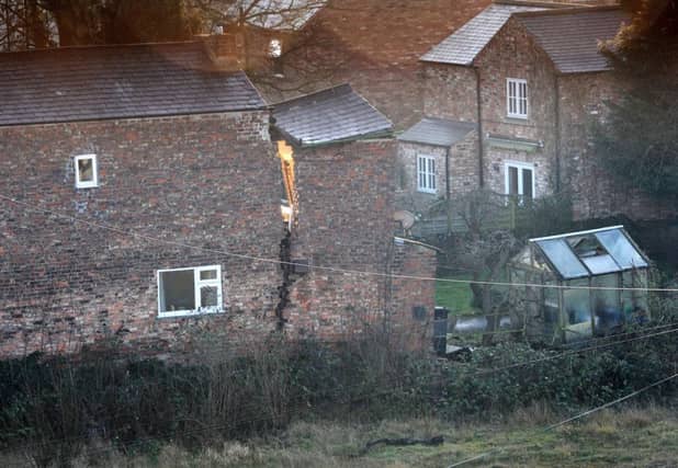 The house in Ripon where a 25ft sinkhole has caused a crack. Picture: PA