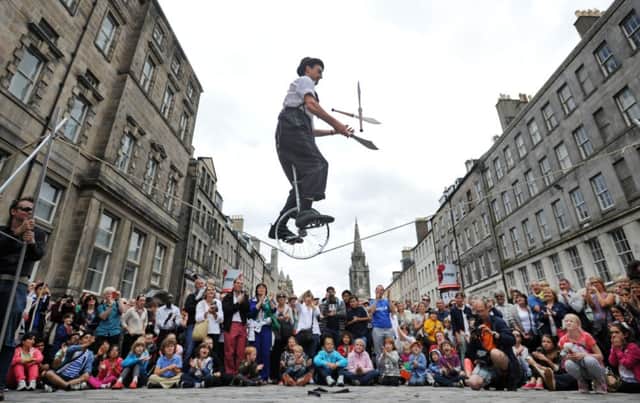 A street performer on the Royal Mile during Edinburgh's festival season. Picture: Jane Barlow