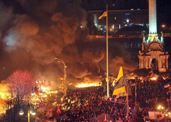 Anti-government protesters clash with the police during their storming of the Independence Square in Kiev. Picture: Getty