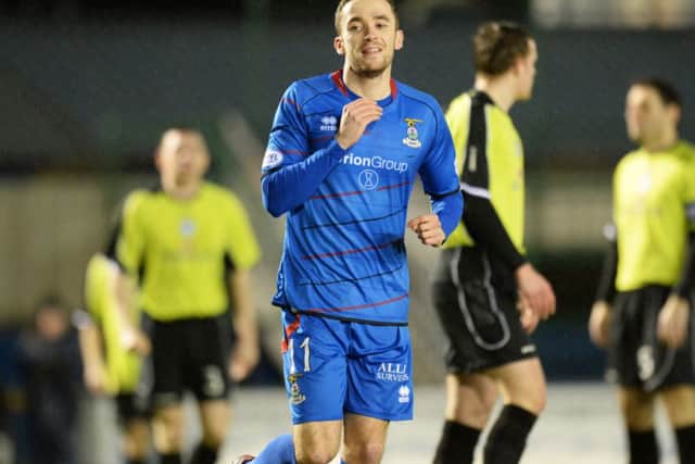 Nicky Ross wheels away to celebrate after opening the scoring. Picture: SNS