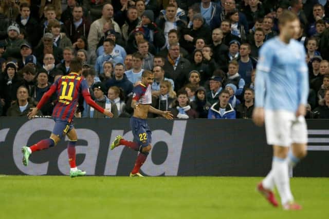 Dani Alves celebrates after scoring Barcelonas potentially decisive second goal. Picture: Reuters