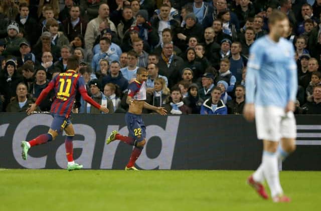 Dani Alves celebrates after scoring Barcelonas potentially decisive second goal. Picture: Reuters