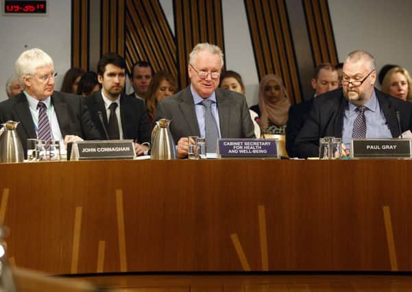 Alex Neil (C) gives evidence to Holyrood's Public Accounts Committee. Picture: Andrew Cowan