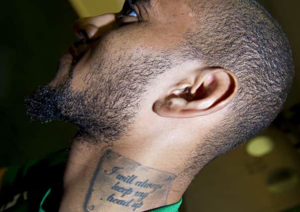 Danny Haynes shows off one of his many tattoos imprinted on the left side of his neck. Picture: SNS