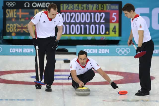 Team GB skip David Murdoch sends down another stone on the way to victory. Picture: PA