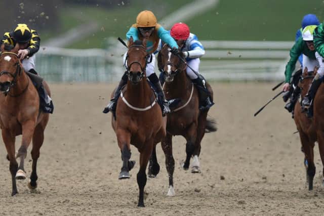 Major Crispies ridden by Ryan Tate, centre, powers away to win the Handicap Stakes. Picture: PA
