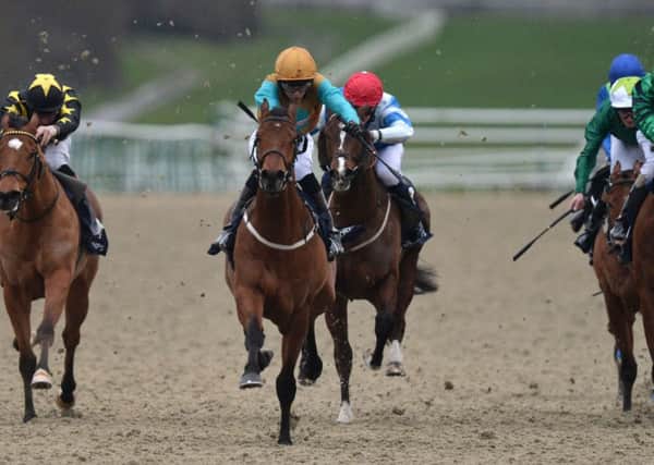 Major Crispies ridden by Ryan Tate, centre, powers away to win the Handicap Stakes. Picture: PA