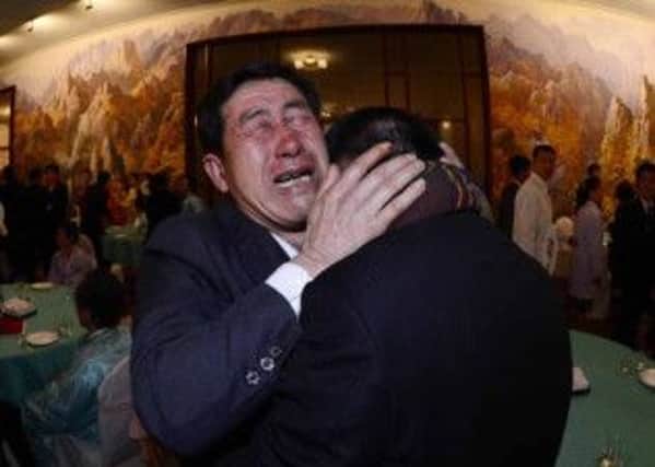 Park Yanggon, right, is reunited  with his brother Park Yangsu, who was abducted by North Korea. Picture: Reuters