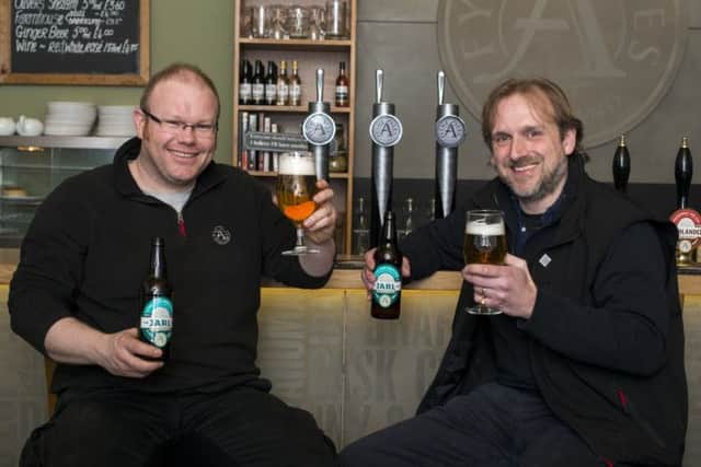 MD Jamie Delap, right, and head brewer Malcolm Downie sample some Jarl ale. Picture: Gordon Burniston